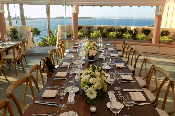 Professionally set table overlooking ocean