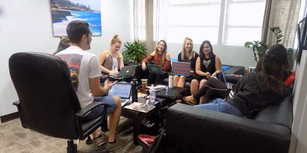 Students studying on a couch